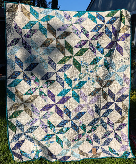Teal and purple throw quilt