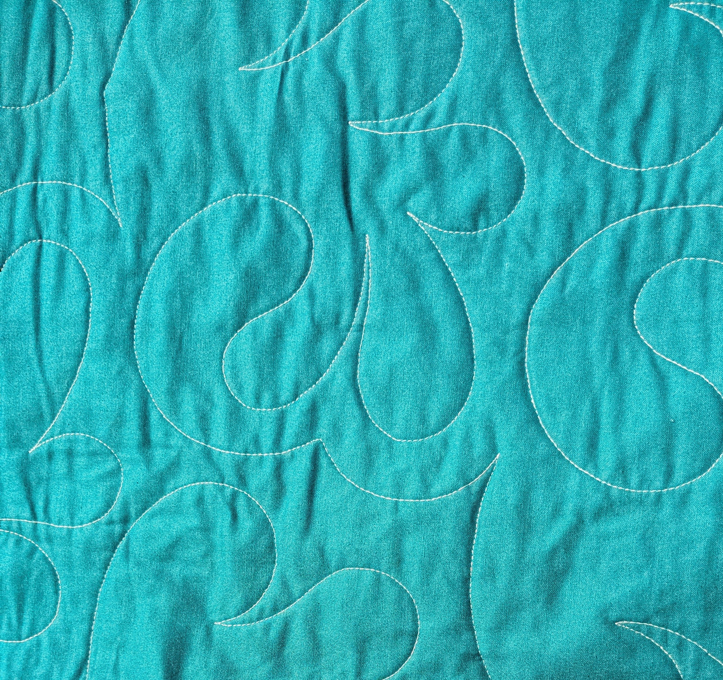 Teal and purple throw quilt