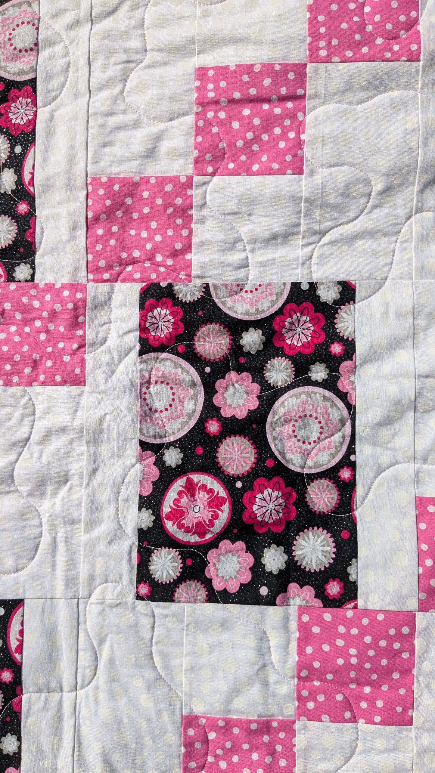 Pink and black throw quilt